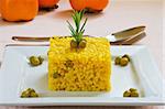 spanish and mediterranean yellow rice style on white platter
