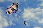 man flying on a parachute