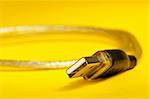 USB cable on yellow background
