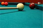 An image of some billiard balls with a cue stick