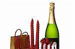 Christmas decoration with champagne bottle and candles, over white background. Shallow DOF