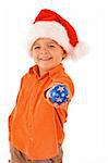 Boy in santa hat holding christmas bauble - isolated - shallow depth of field - focus on the hand