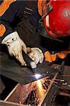 welder at shipyard working on steel project