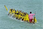 Paddlers in a longboat during a race in Thailand