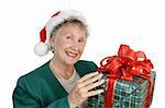 A friendly senior lady holding a big Christmas gift.  Isolated on White.
