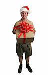 A full view of a delivery man with a Santa hat delivering a gift - isolated