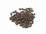 Black peppercorns in isolated white