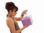 Surprised woman opening a purple gift box