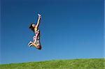 Happy woman on a beautiful green meadow