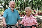 An attractive senior couple out for a bike ride together.