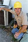A handsome, competent looking air conditioning repairman