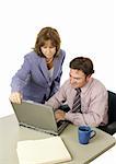 A male-female business team working intensely trying to meet a deadline.  Isolated on white.