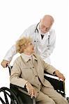 Disabled senior woman trusts her mature, kind doctor.  Isolated on white.
