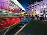 Speed blur of London bus in piccadilly circus at night
