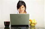 beautiful woman with laptop over white