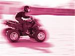 Close-up of a man driveing a quad