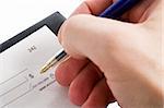 A male hand filling out the amount on a cheque. Isolated on white with clipping path.