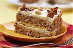 cake with almonds and nut on the yellow plate