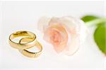 Engagement ring with rose on a white background,very shallow focus