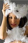 a beautiful young girl in white carnival mask making face