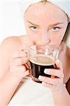 Studio portrait of a spa girl smelling her morning coffee