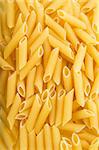 Penne Rigate pasta background texture