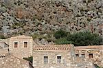 Old preserved stone houses under the steep cliff of the castle-town of Monemvasia, Greece