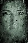 Background made with old textured paper with a female face