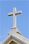 Christian cross in the roof of a church