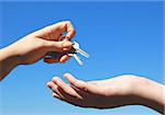 Handing keys from one person to another. symbolizes success