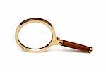 Magnifying glass in a brass frame with a wooden handle.