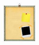 isolated pinboard with adhesive note and photo frame