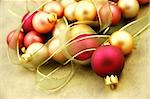 Christmas ornaments on paper surrounded by ribbon