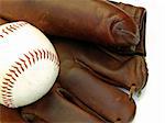 an older style baseball glove and ball