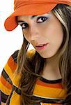 Beautiful young woman portrait with a orange hat