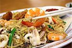 Chinese fried seafood noodles with prawns and squid