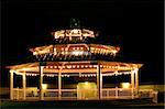 This is a photograph of the well lit and empty gazebo in downtown Safety Harbor, Florida shot at night.