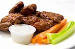Spicy chicken wings served with carrots and celery and a dipping sauce