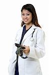 Female attractive Asian doctor wearing white lab coat wearing a stethoscope around shoulders and holding a blood pressure cuff smiling standing on white background