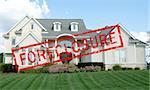 Foreclosure red stamp across a luxury home