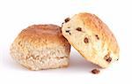 two scones and one raisin on white background