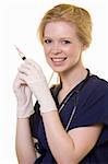 Young pretty woman healthcare worker wearing blue scrubs and a stethoscope holding a syringe over white