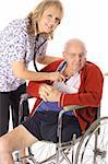 beautiful nurse checking elderly patient