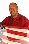African American war veteran holding an American flag