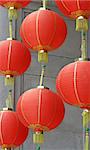 Red chinese lanterns swinging in the breeze