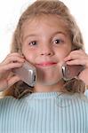 young girl talking on two cellphones