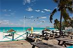 beach bar tables and chairs overlooking tropical beach