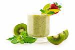 A glass of kiwi smoothie isolated on white background