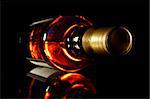 Bottle of whisky with black crisp background