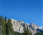 snow rocks and nice mountians over blue sky